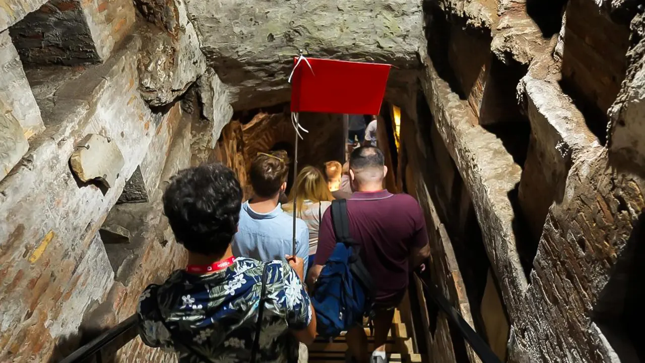 Catacombs with a tour guide by Transport